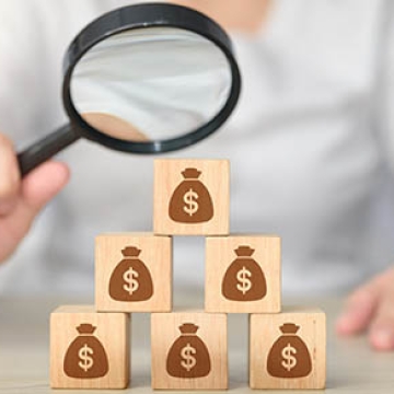 magnifying glass on finances