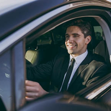 man driving car