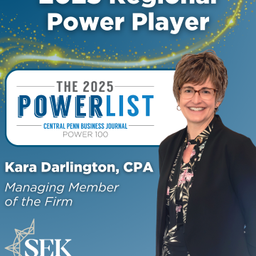 woman in business attire on blue background for award